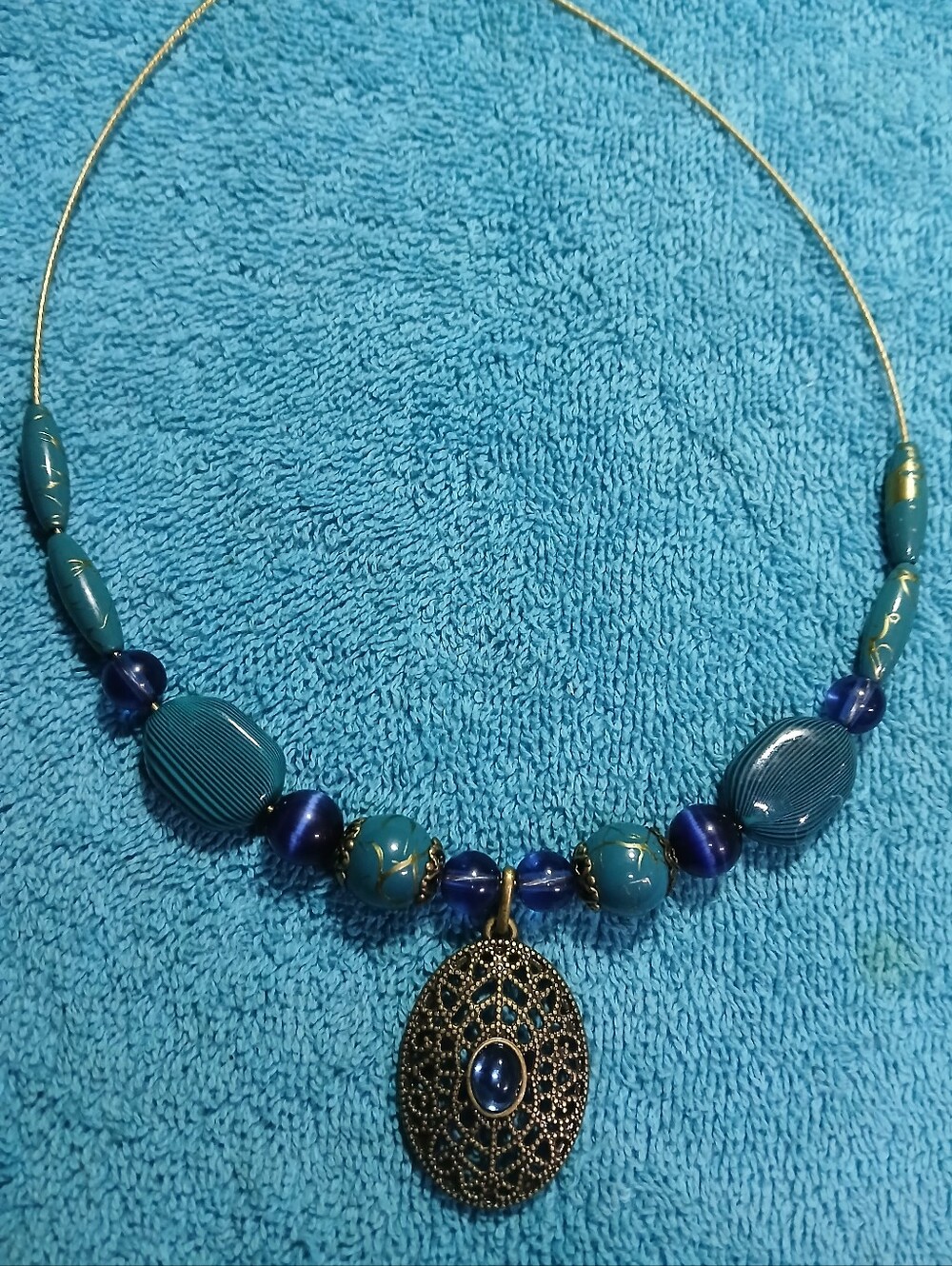 Blue Beaded Filigree Pendant Necklace With Gold Accents On Gold Wire